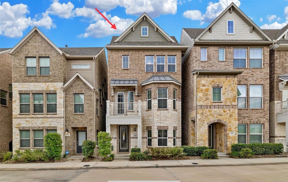 Front entry of Single Family Home with a balcony