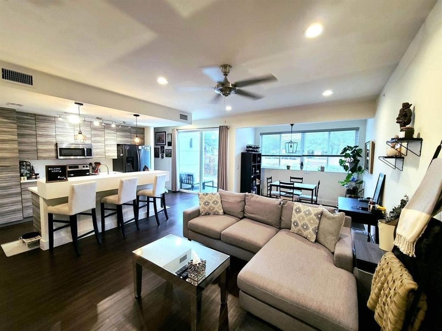 2nd Level boasts open living area, dining and kitc