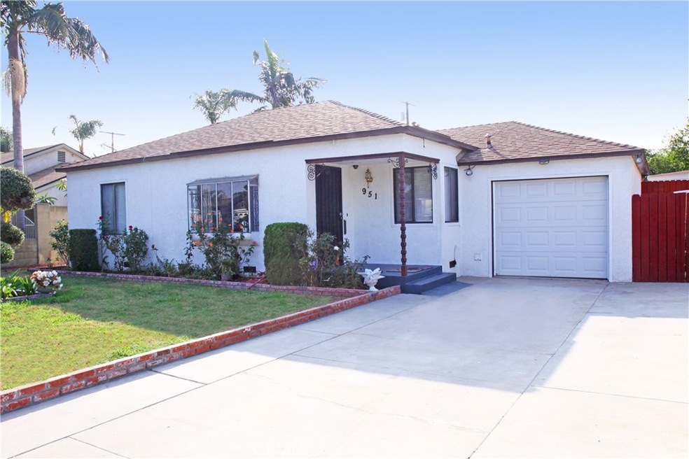 Beautiful curb appeal, large gated driveway and single car garage.