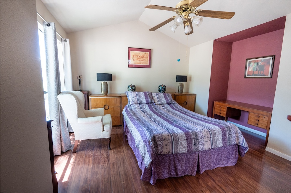 Bedroom #1 has a fan and vaulted ceiling.