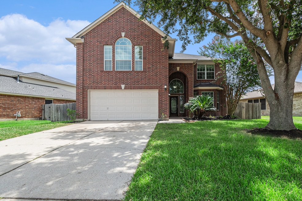 This inviting two-story brick home features a spac