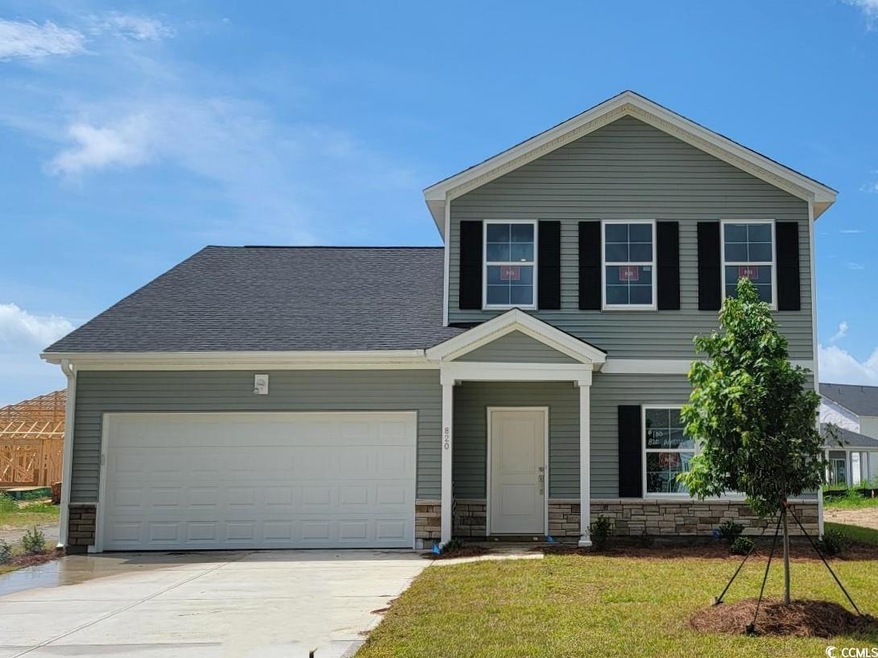 View of front of property with a garage and a fron