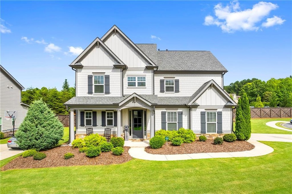 Craftsman inspired home with a front yard