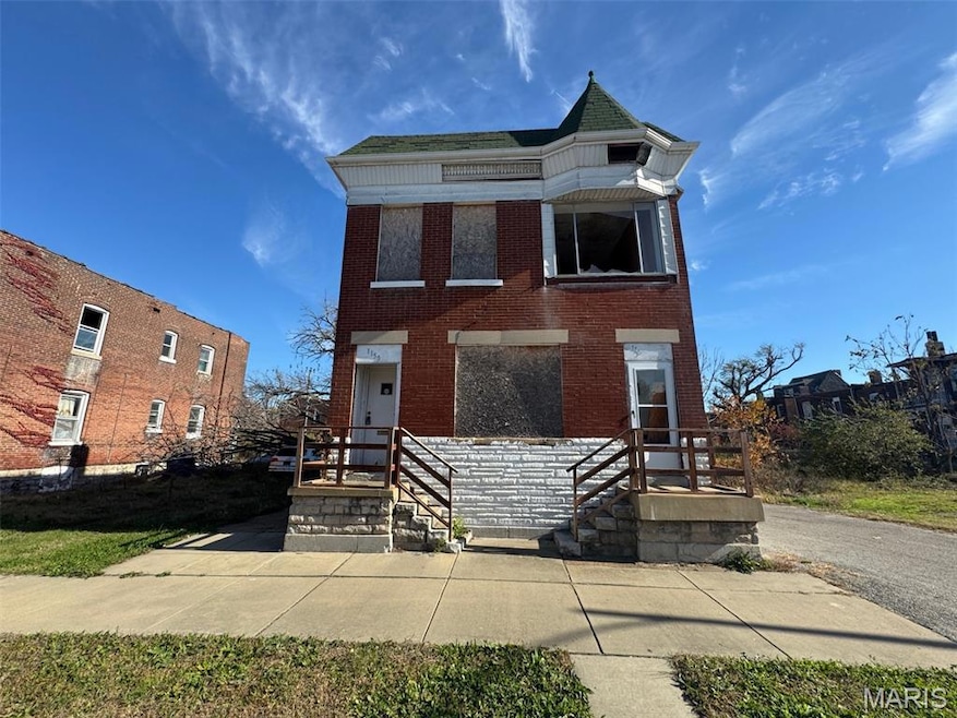 View of front of home featuring brick siding