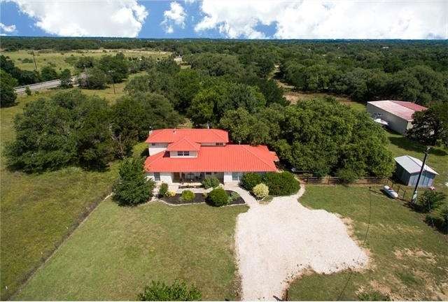 Front shot of entire acreage.... Main house in cen