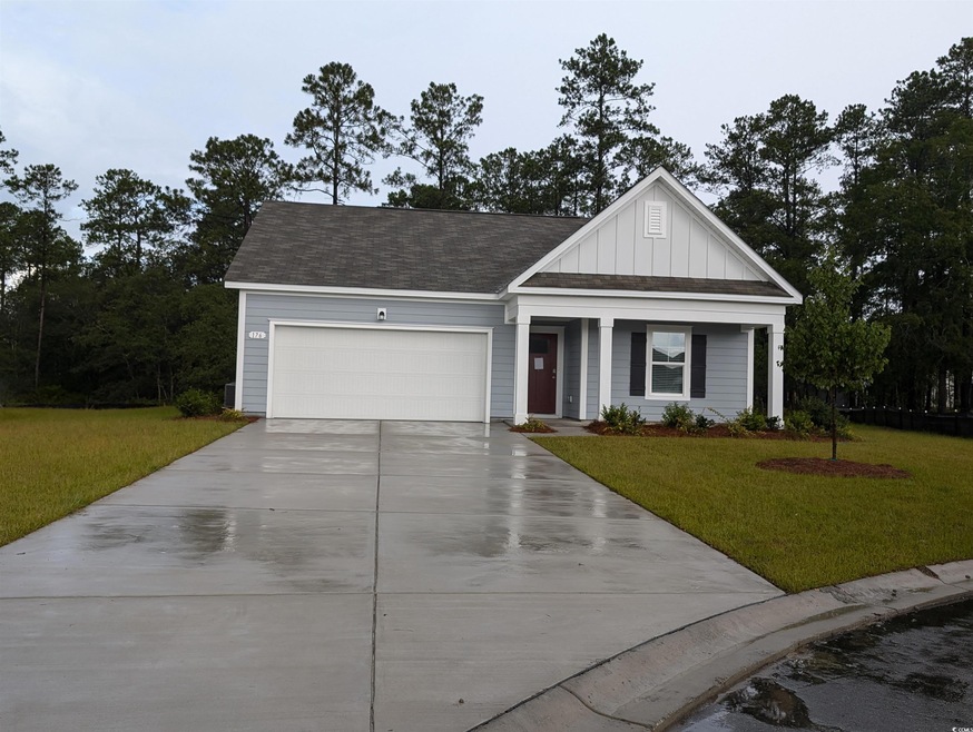 View of front of house featuring a garage and a fr