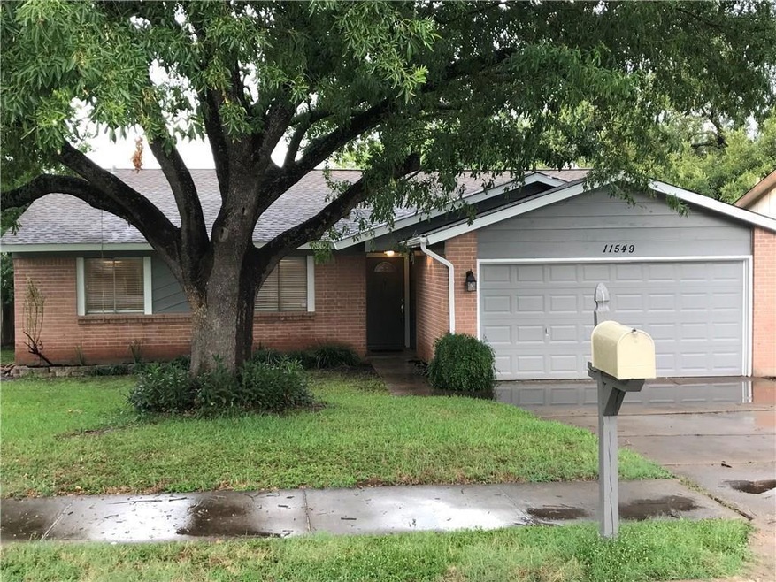 Ranch-style house with a front yard, brick siding, and an attached garage