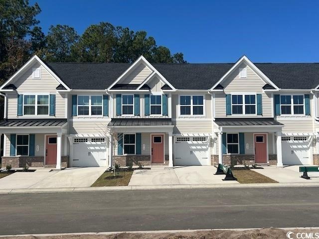 View of front of property with a garage