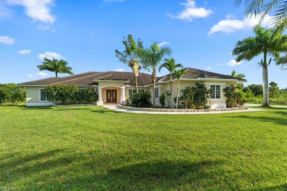 Single story home with stucco siding and a front yard