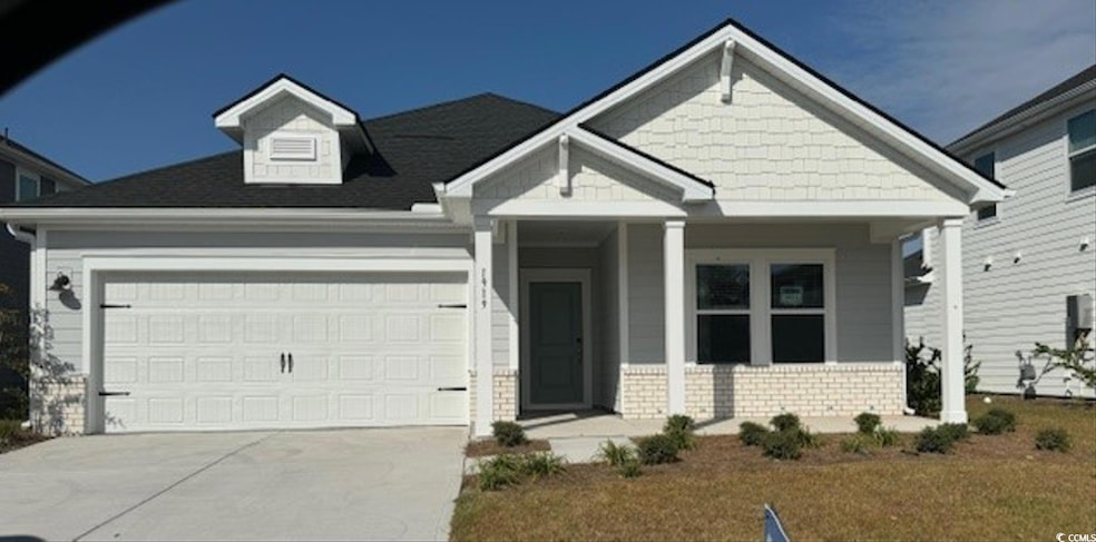 Craftsman-style house featuring covered porch and 