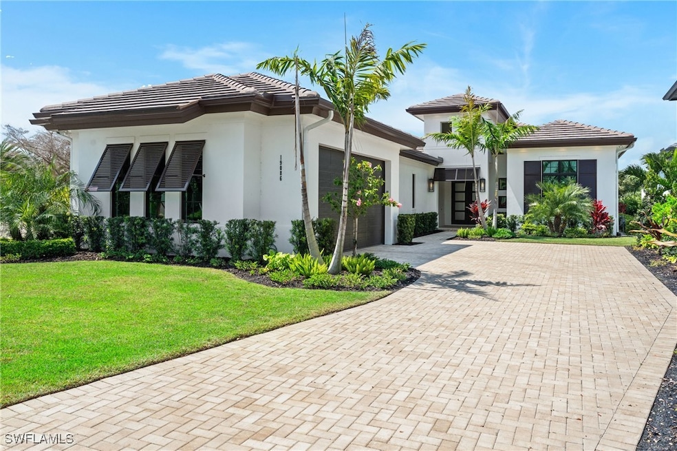 View of front of property featuring a tiled roof,