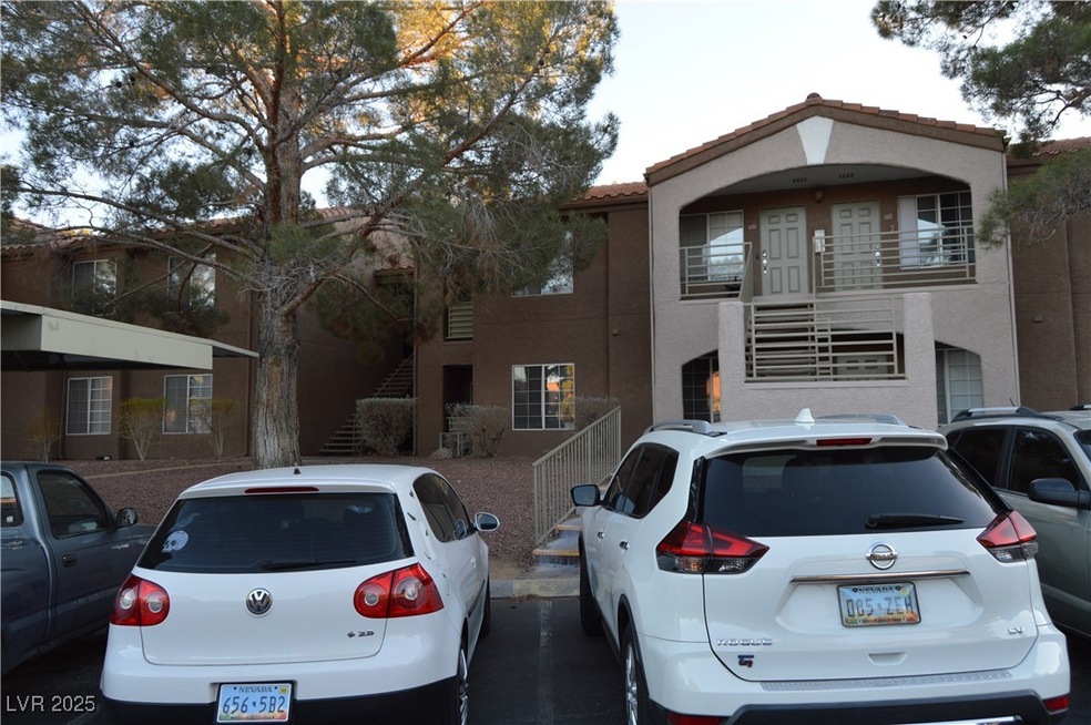 View of front of house with a tiled roof, stairway