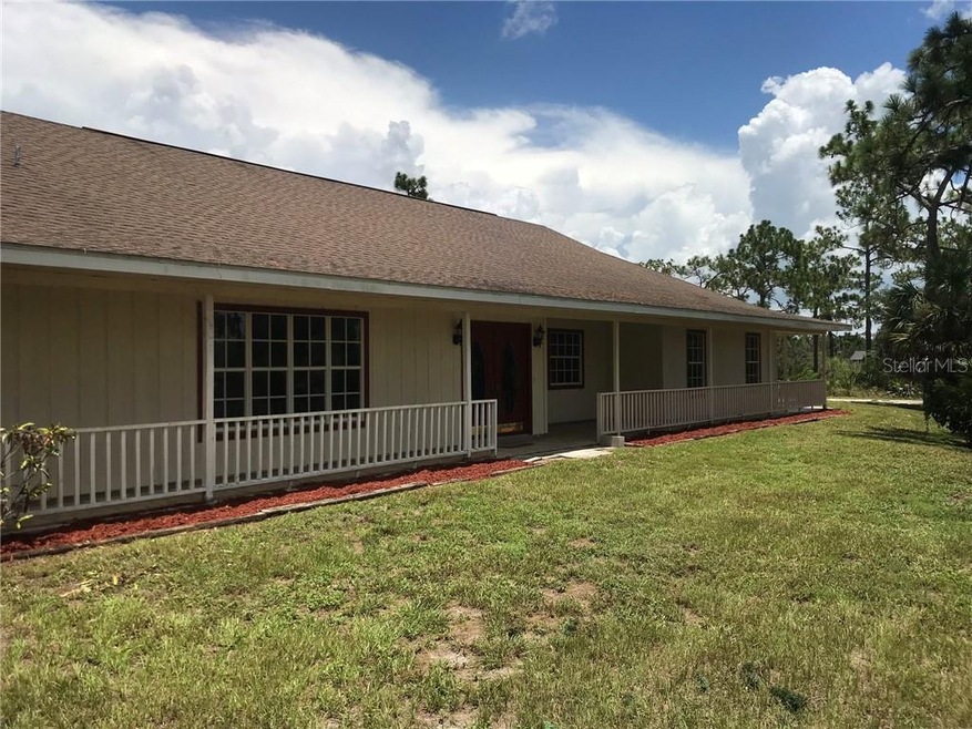 Front of home with large front porch.