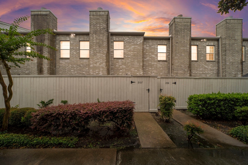 Front Exterior View with fenced in pation in front