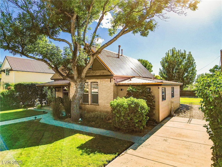 View of front of house featuring a metal roof and a standing seam roof