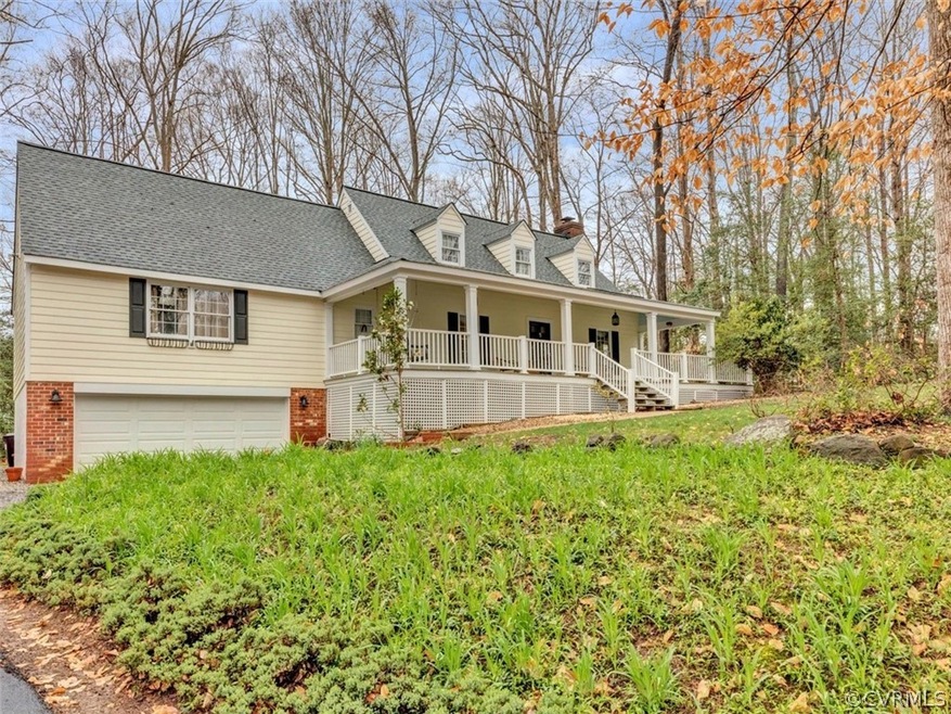 Charming Cape with full front covered porch.