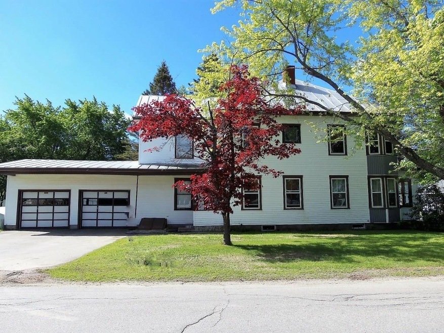 View of large garage and side entry...