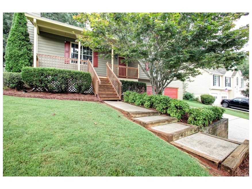 Front view of home with rocking chair front porch 