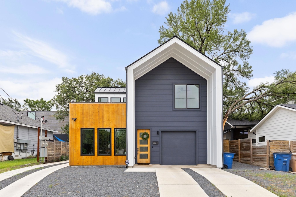 Contemporary house with an attached garage, drive