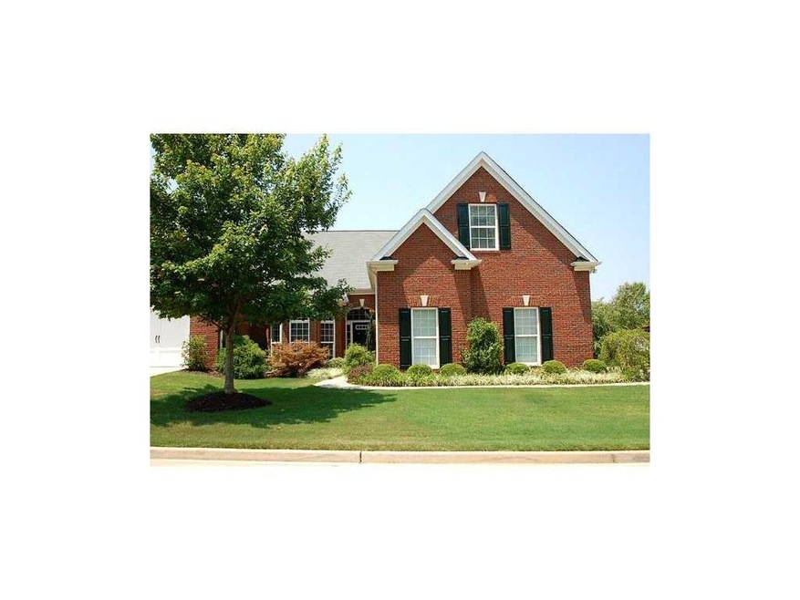 Exterior Front. Classic, gabled, 3-side brick corn