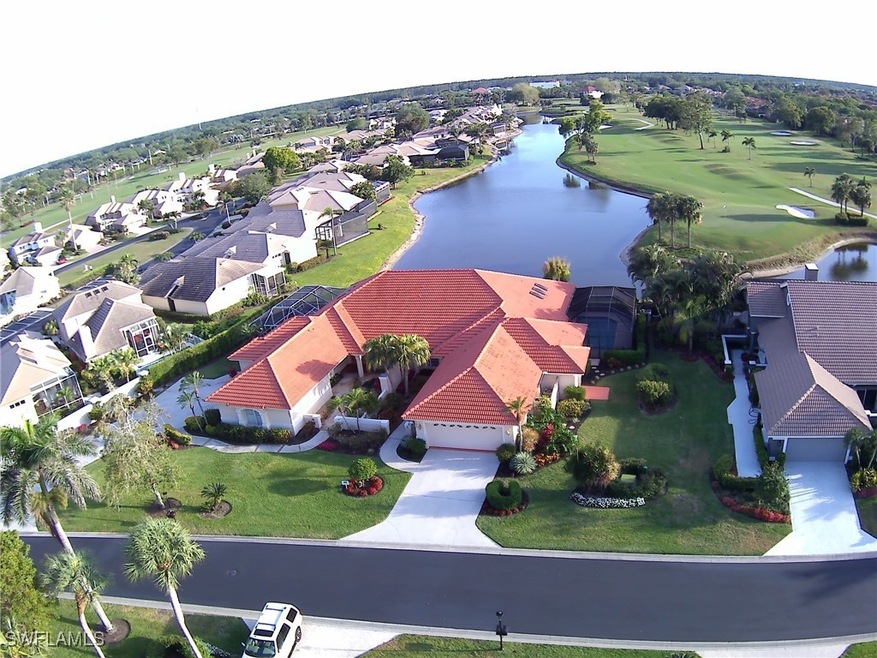 Bird's eye view featuring a water view and a resid
