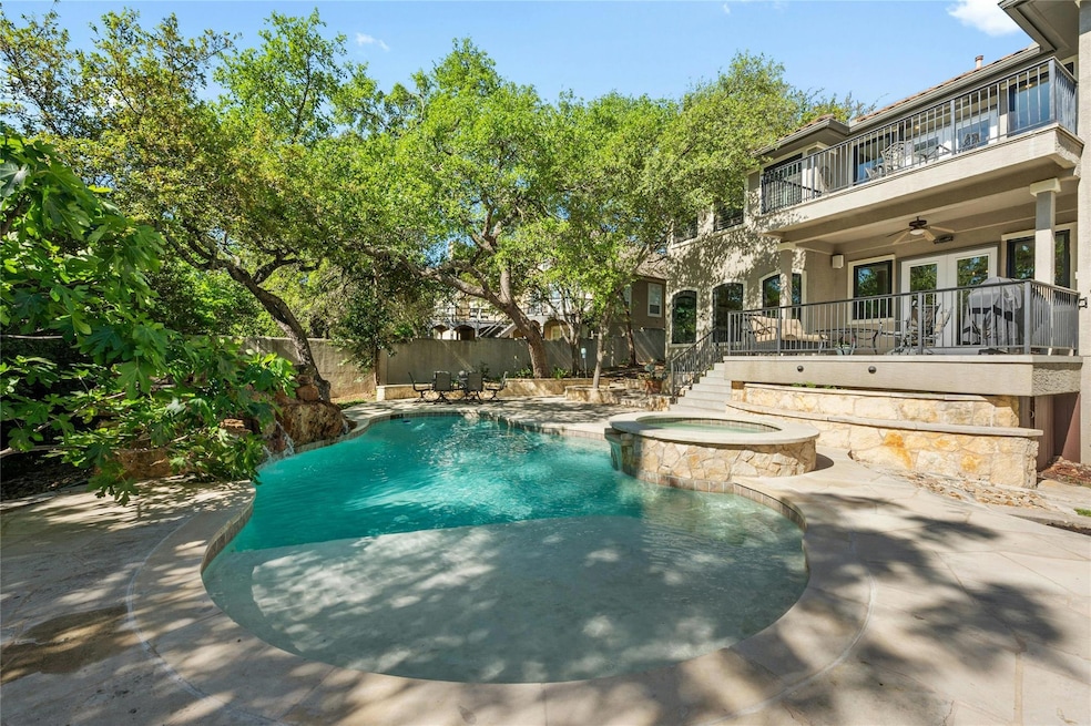 View of pool with ceiling fan, a patio, stairs, a