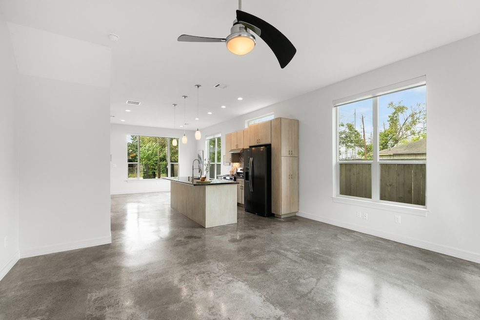 Gourmet island kitchen with sleek finishes flows t