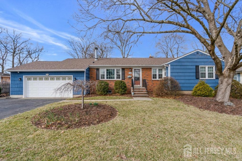 Front View Of Ranch Home,Partial Brick Front and Painted Cedar Shakes