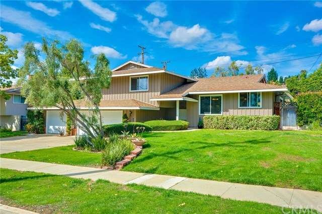 Curbside view  of this lovely split level ranch st