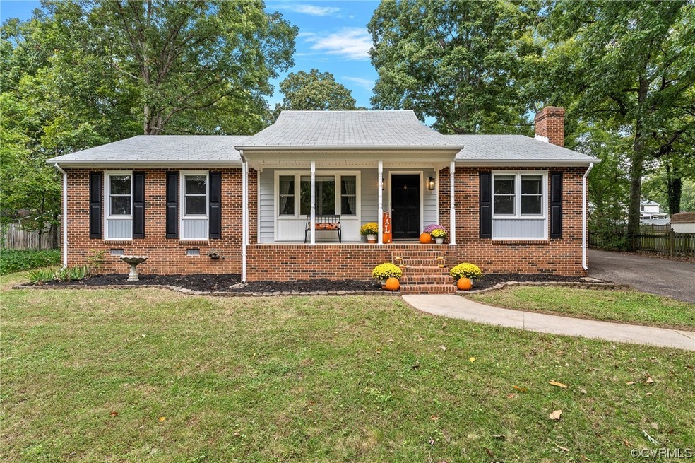 Ranch-style home featuring covered porch and a fro
