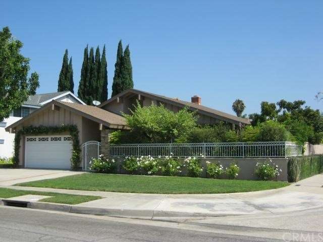 LUSHLY LANDSCAPED WITH GREAT CURB APPEAL 