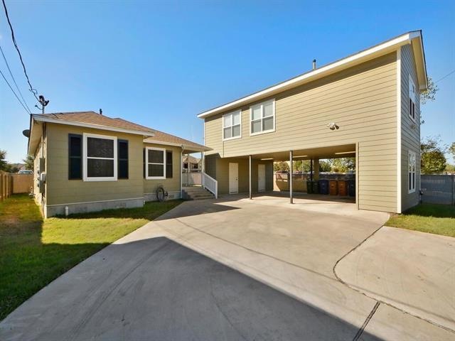 Triplex exterior.  Each unit has one covered parking spot.