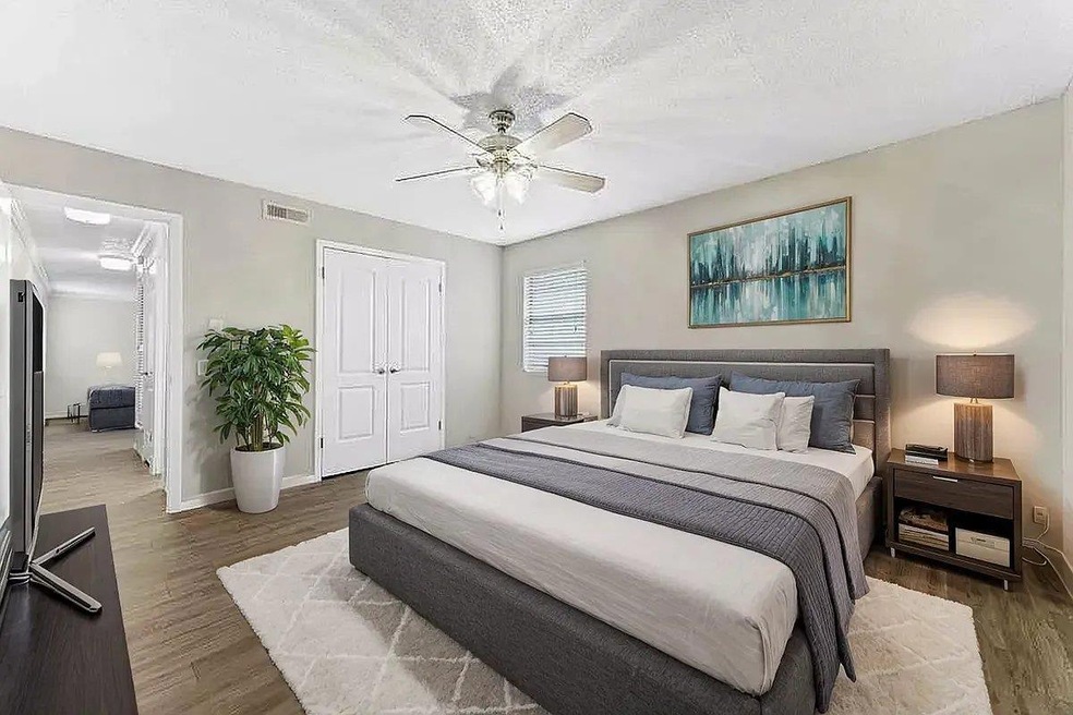 Bedroom featuring wood finished floors, a closet,