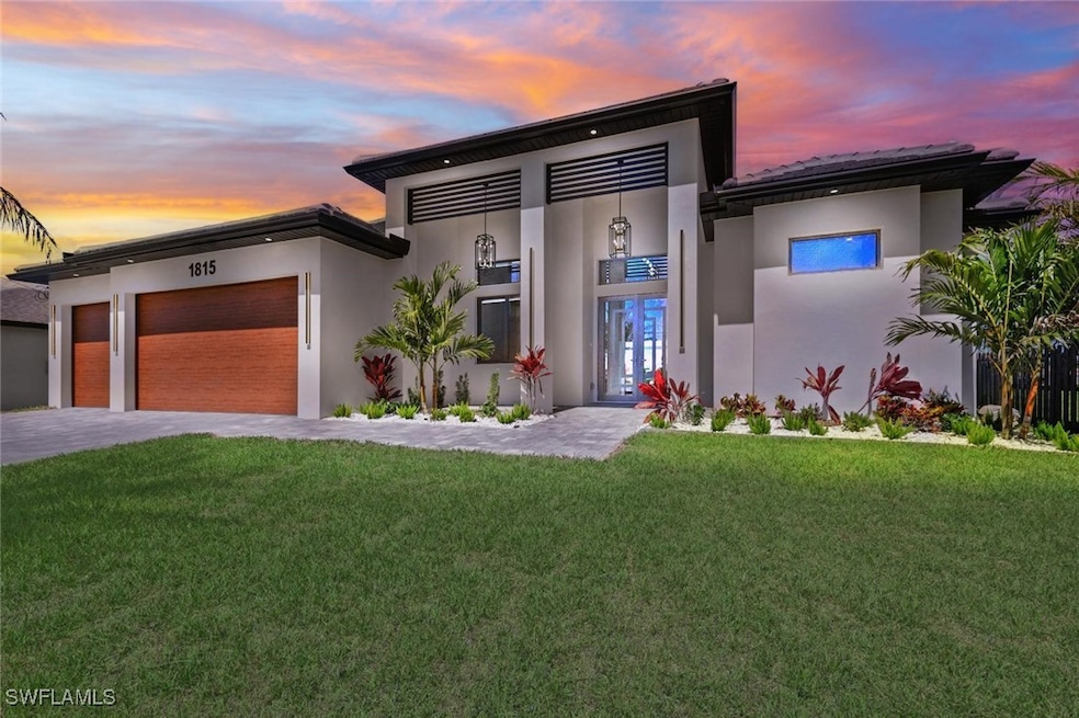 Contemporary home featuring stucco siding, an atta