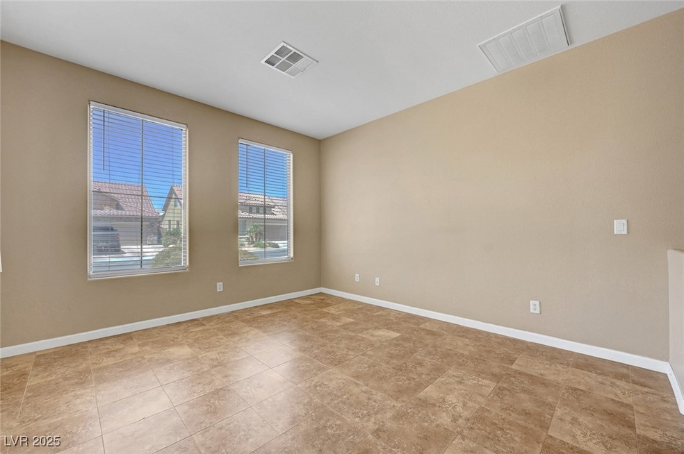 Empty room featuring baseboards