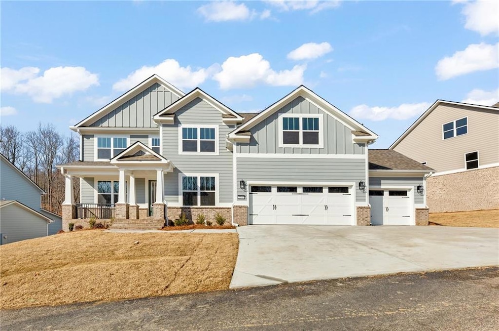 Craftsman-style house with a porch and 3rd car gar