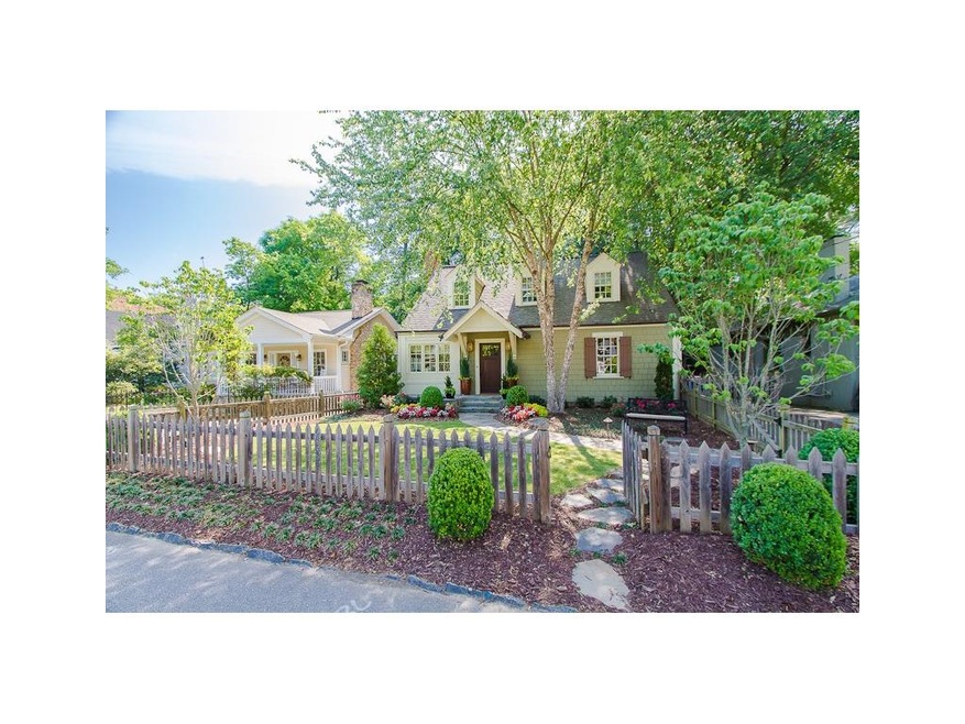 Perfection!  Beautifully landscaped fenced front y