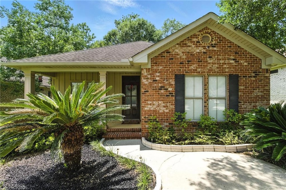 Ranch-style home with board and batten siding, brick siding, and roof with shingles