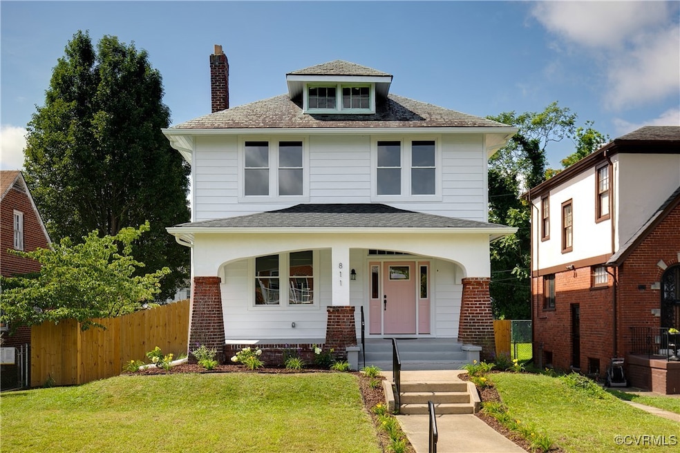 Traditional style home with a chimney, a shingled