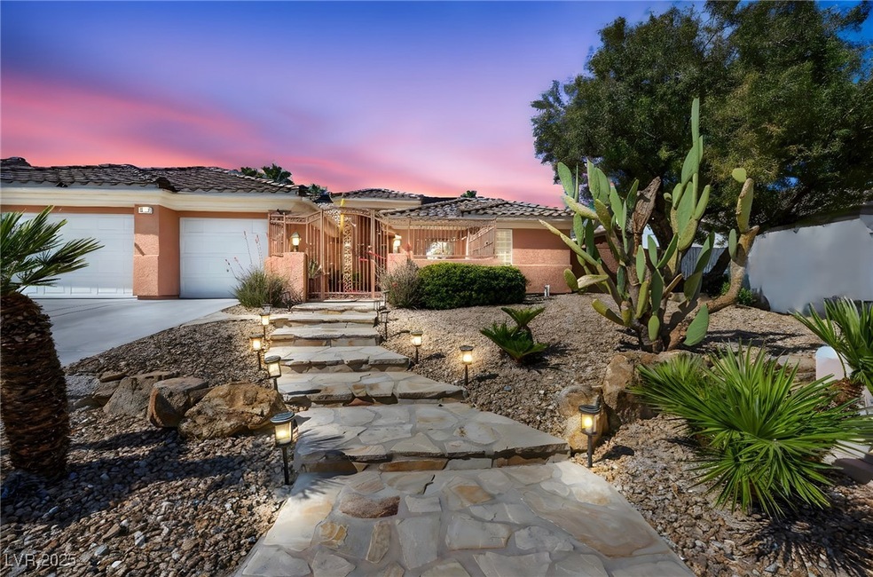 View of front of house with stucco siding, a tile