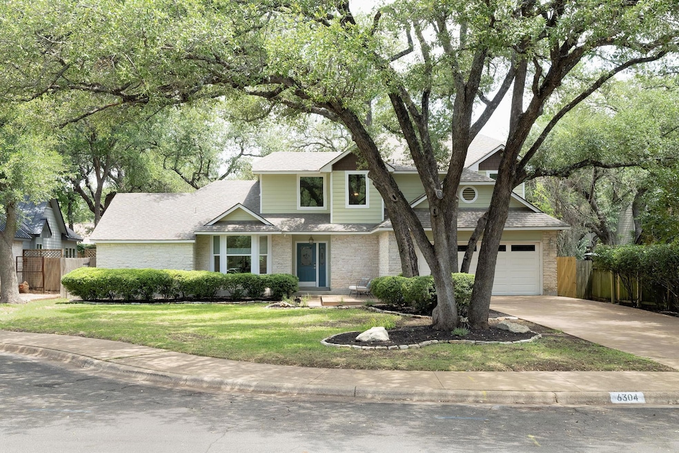 View of front of home with brick siding, driveway