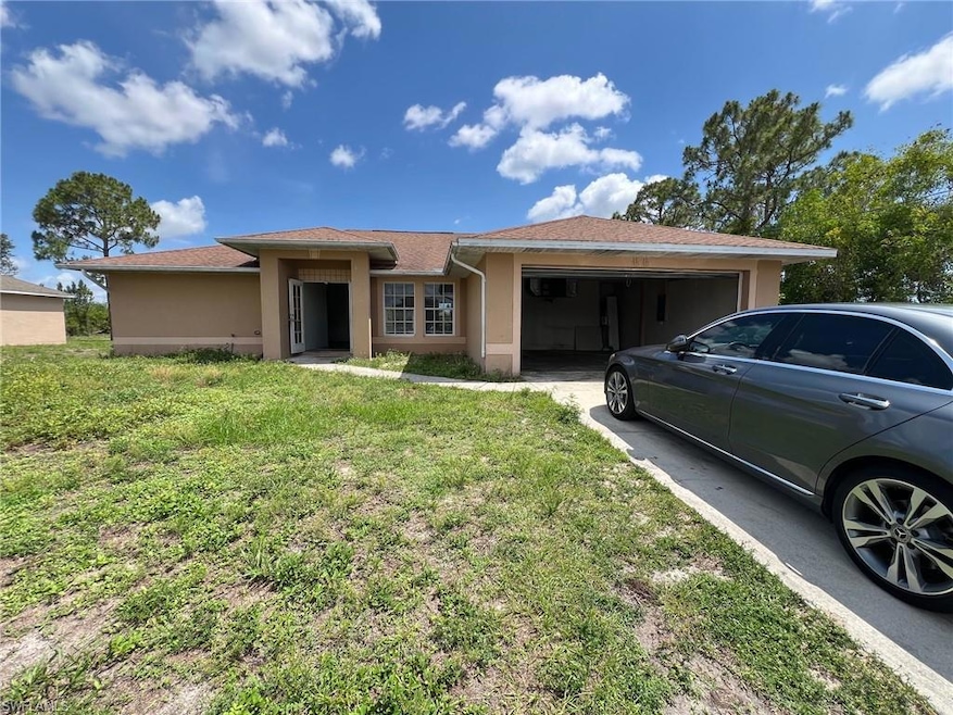 Front of house with its 2 car garage