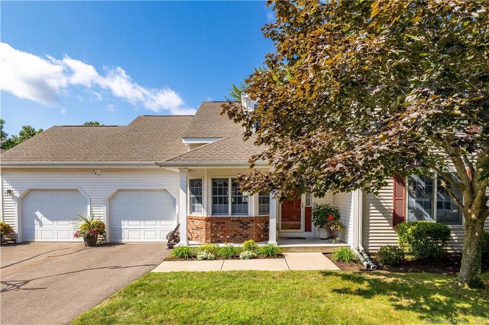 Beautiful end unit with desirable 2 car garage