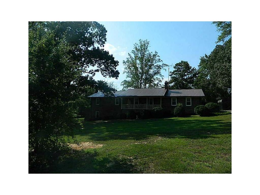 Exterior Front. All brick with metal roof sits on 