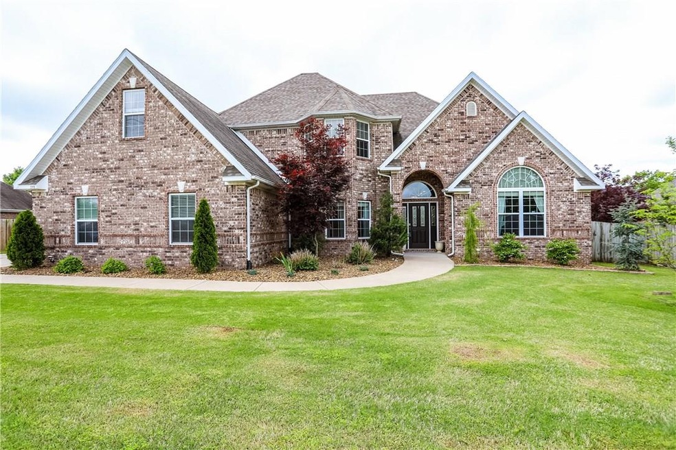 All brick home with a lot of windows and a 3 car garage. Large lot that is beautifully landscaped.