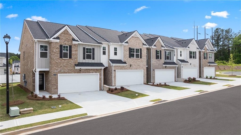 Townhome / multi-family property with a garage