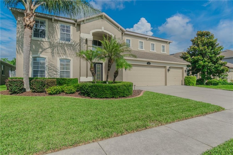 Front of home showing beautiful landscaping