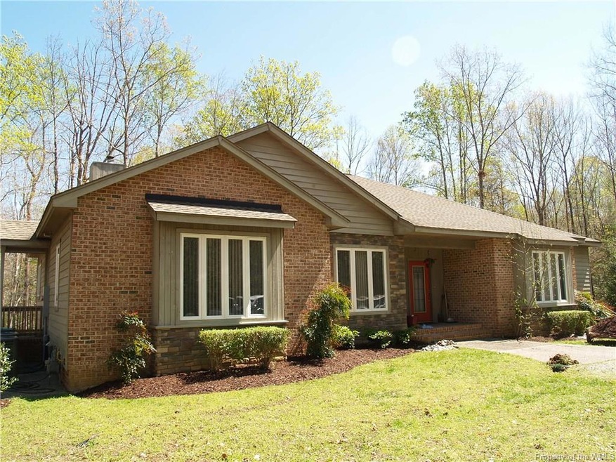 Brick and Cedar Siding with Stone Accent