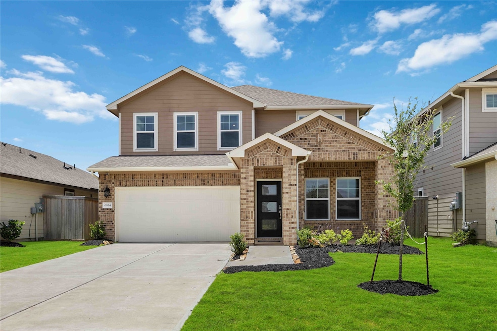 A harmonious blend of brick, stone, and smooth cem