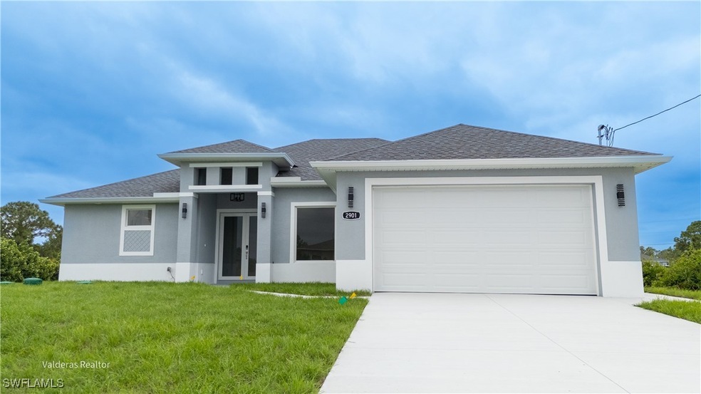 Prairie-style house with concrete driveway, stucco